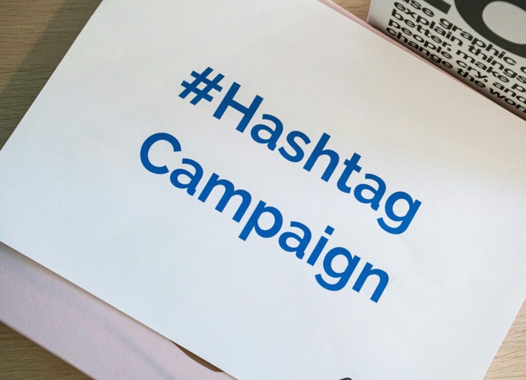 A concept image of a hashtag campaign displayed on paper for marketing strategies.